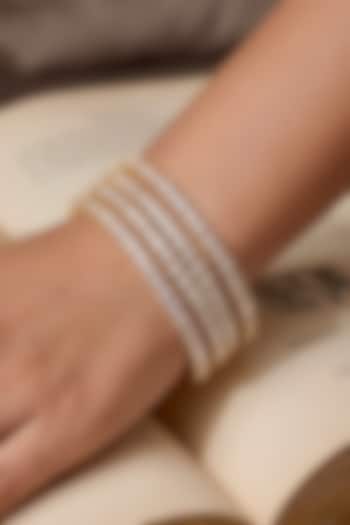 Gold Finish Precision-Set Crystal Bangles (Set Of 4) by Prestones at Pernia's Pop Up Shop