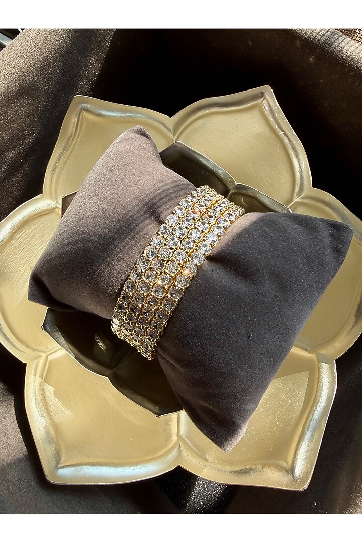 Gold Finish Precision-Set Crystal Bangles (Set Of 4) by Prestones at Pernia's Pop Up Shop