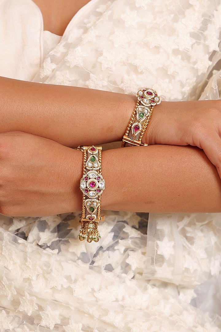 Antique Gold Finish Kundan Polki & Ruby Stone Temple Bangles (Set Of 2) by Prestones at Pernia's Pop Up Shop