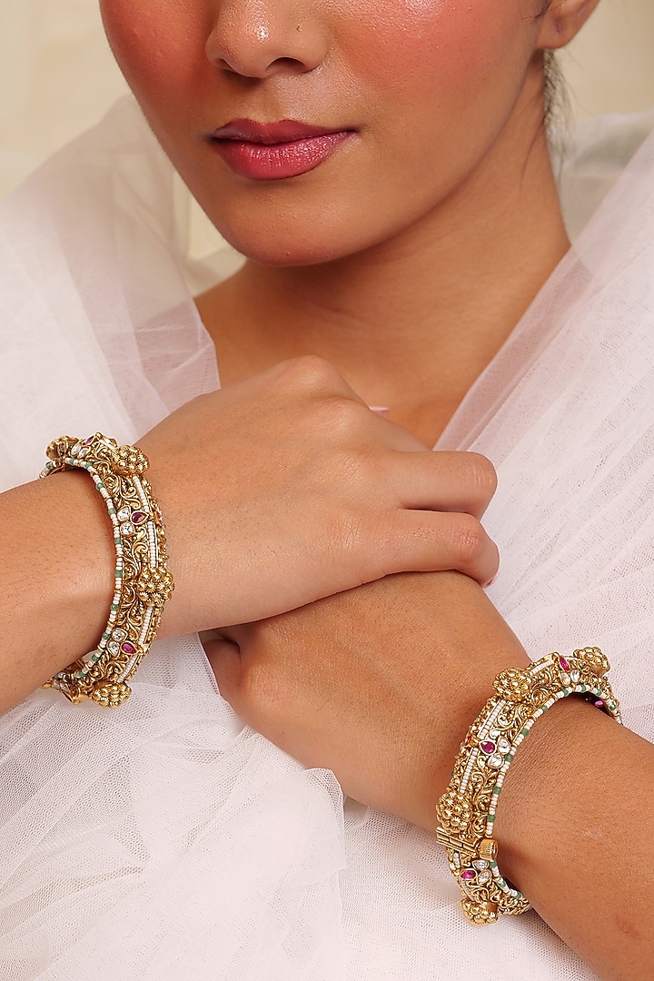 Antique Gold Finish Kundan Polki Filigree Jaal Work Temple Bangle (Set Of 2) by Prestones at Pernia's Pop Up Shop