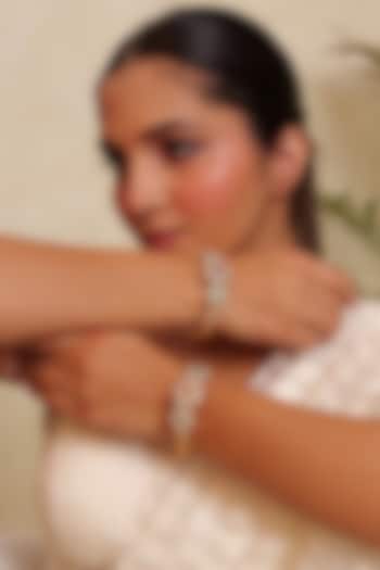 Antique Gold Finish Kundan Polki & Pearl Temple Bangle (Set Of 2) by Prestones at Pernia's Pop Up Shop