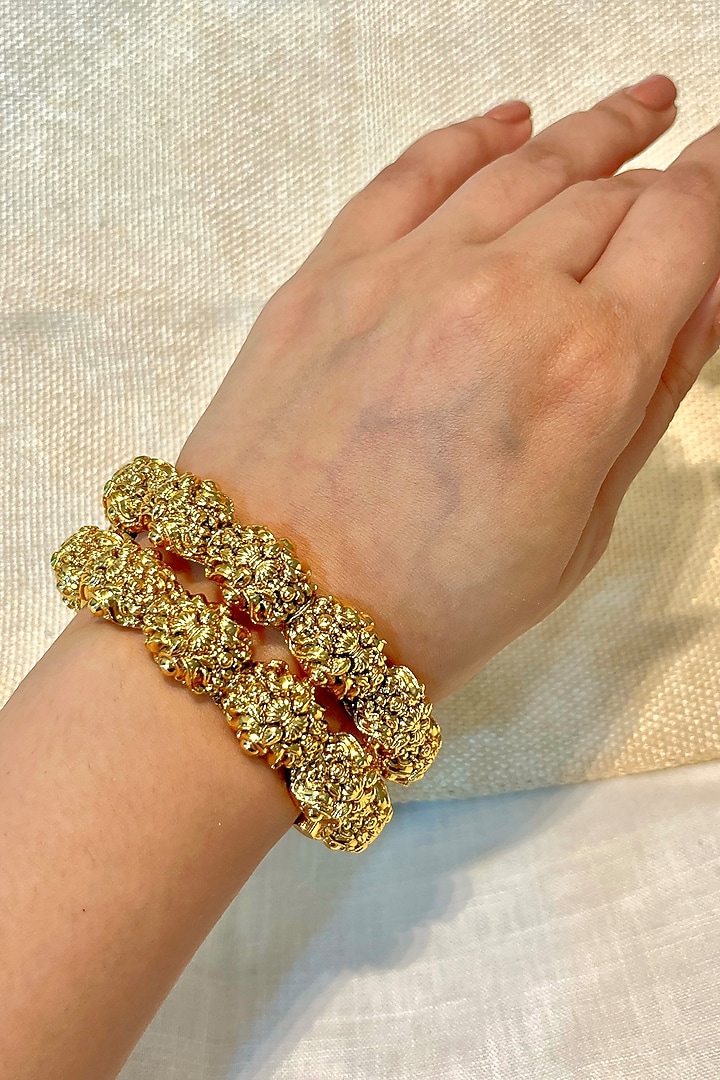 Gold Finish Temple Carved Bangles (Set Of 2) by Prestones at Pernia's Pop Up Shop
