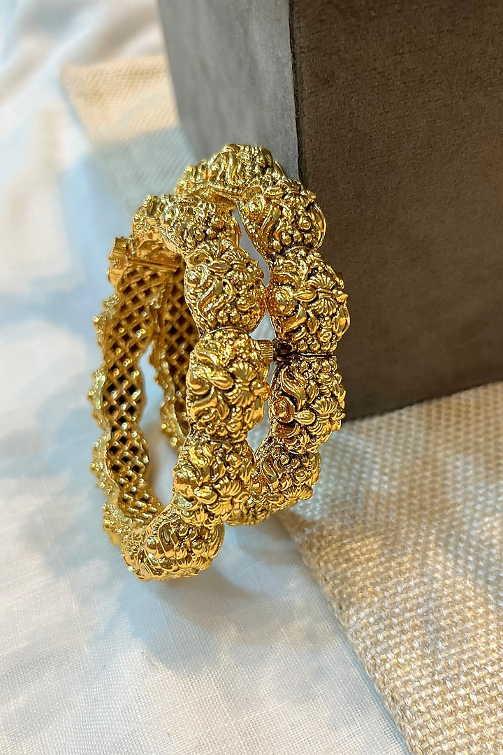 Gold Finish Temple Carved Bangles (Set Of 2) by Prestones at Pernia's Pop Up Shop