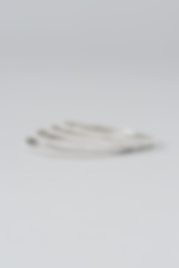 White Rhodium Finish Zircon Bangles (Set of 4) by Prestones at Pernia's Pop Up Shop