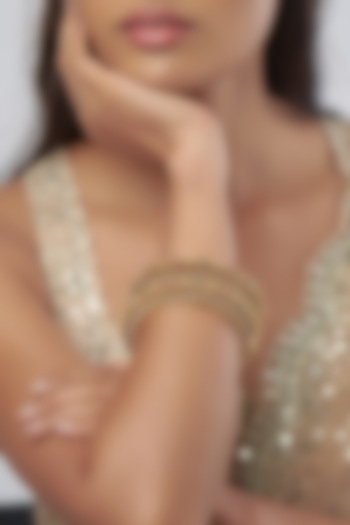 Gold Finish Stone & Pearl Filigree Bangles (Set Of 2) by Prestones at Pernia's Pop Up Shop