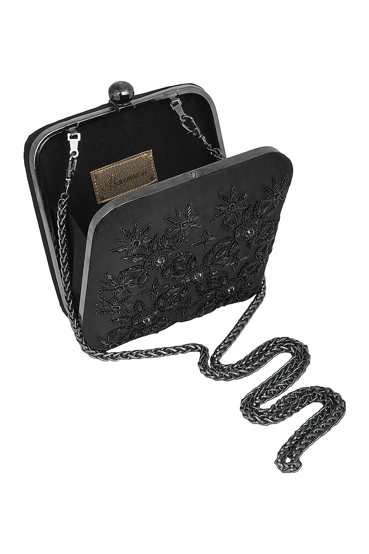 Black embroidered sling clutch bag by PRACCESSORII at Pernia's Pop Up Shop