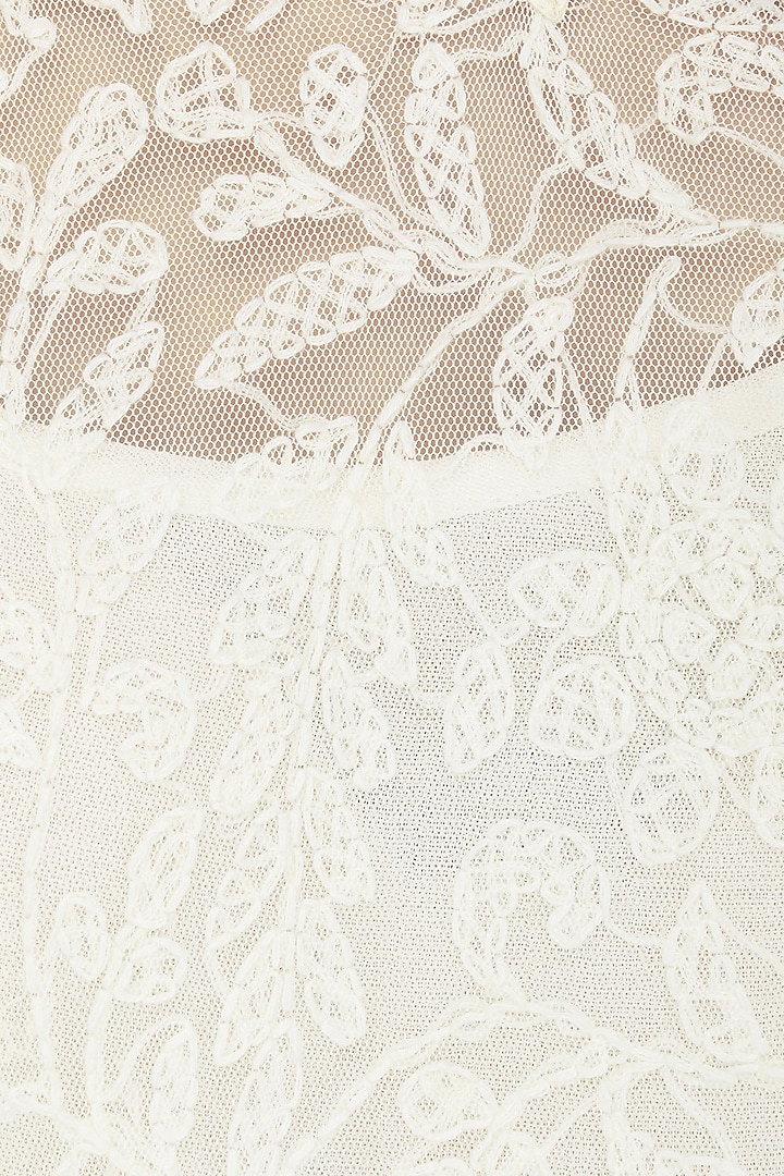 Ivory chikankari kurta set with peach dupatta available only at Pernia's Pop Up Shop.
