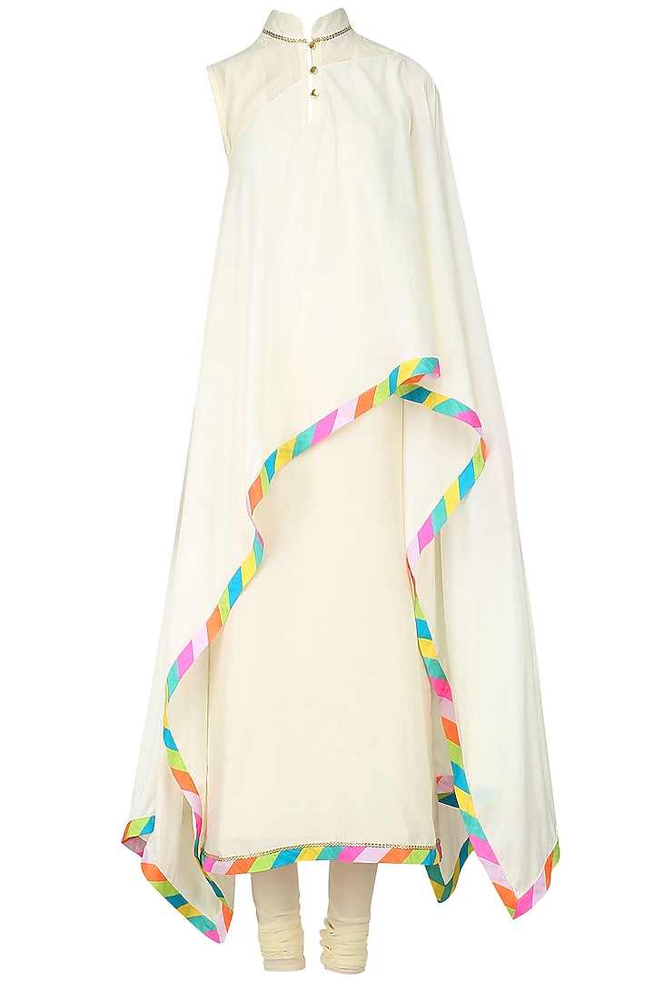 Ivory asymmetric cape with ivory kurta and churidaar available only at Pernia's Pop Up Shop.