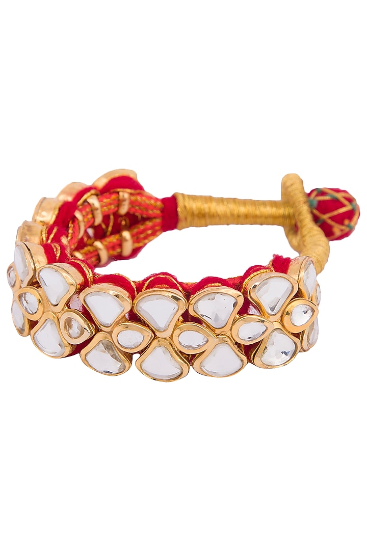 Golden plated kundan and zari pochi bracelet by Parure