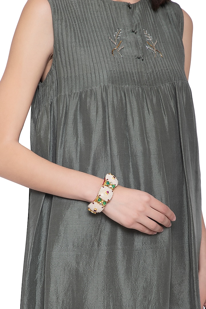 Gold plated pearl, stones, zari and kundan pochi bracelet by Parure at Pernia's Pop Up Shop