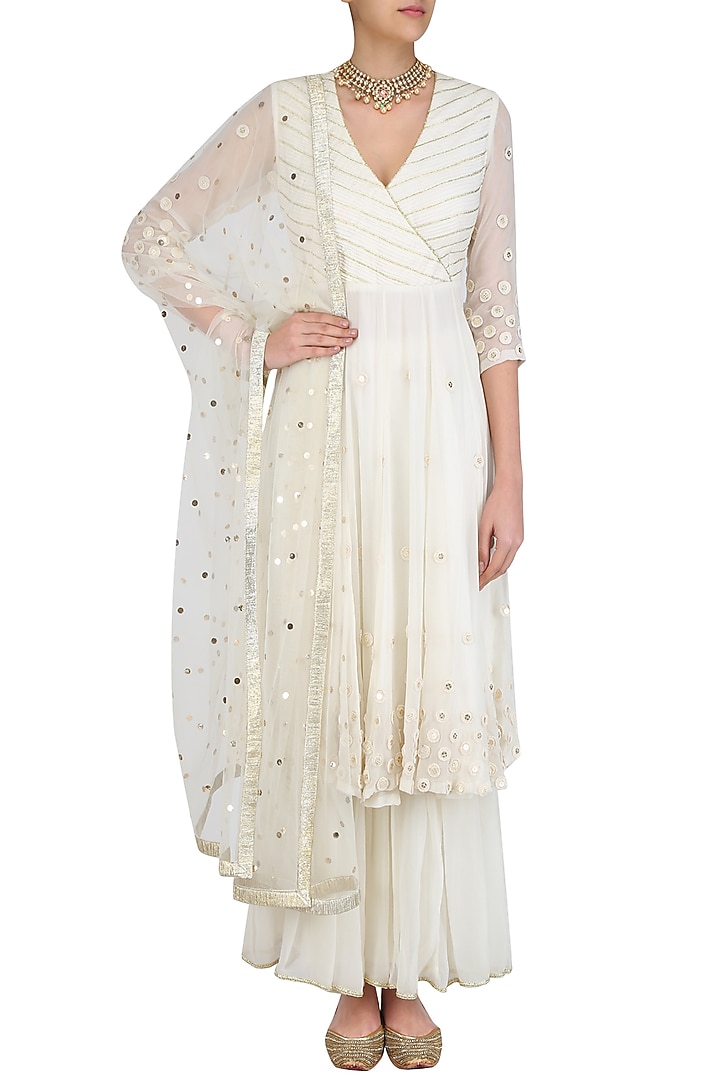 Ivory embroidered agrakha style kurta and sharara pants set available only at Pernia's Pop Up Shop.