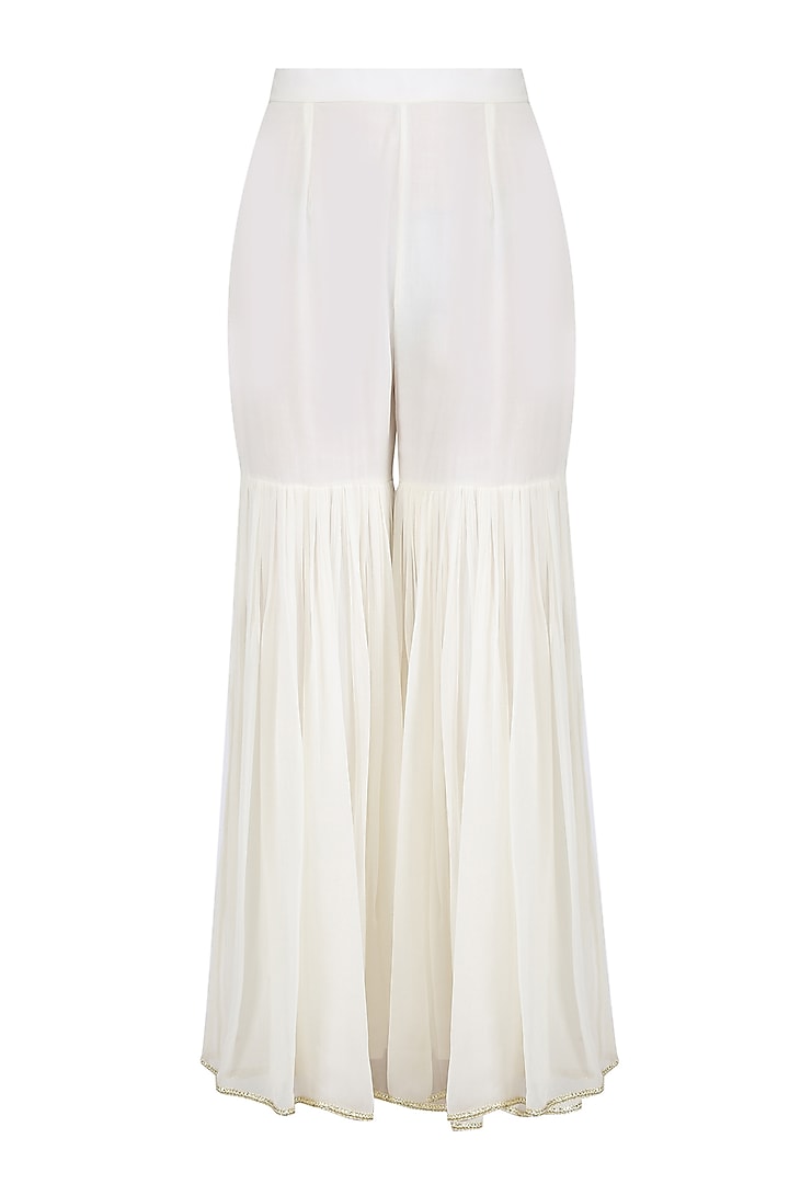 Ivory embroidered agrakha style kurta and sharara pants set available only at Pernia's Pop Up Shop.