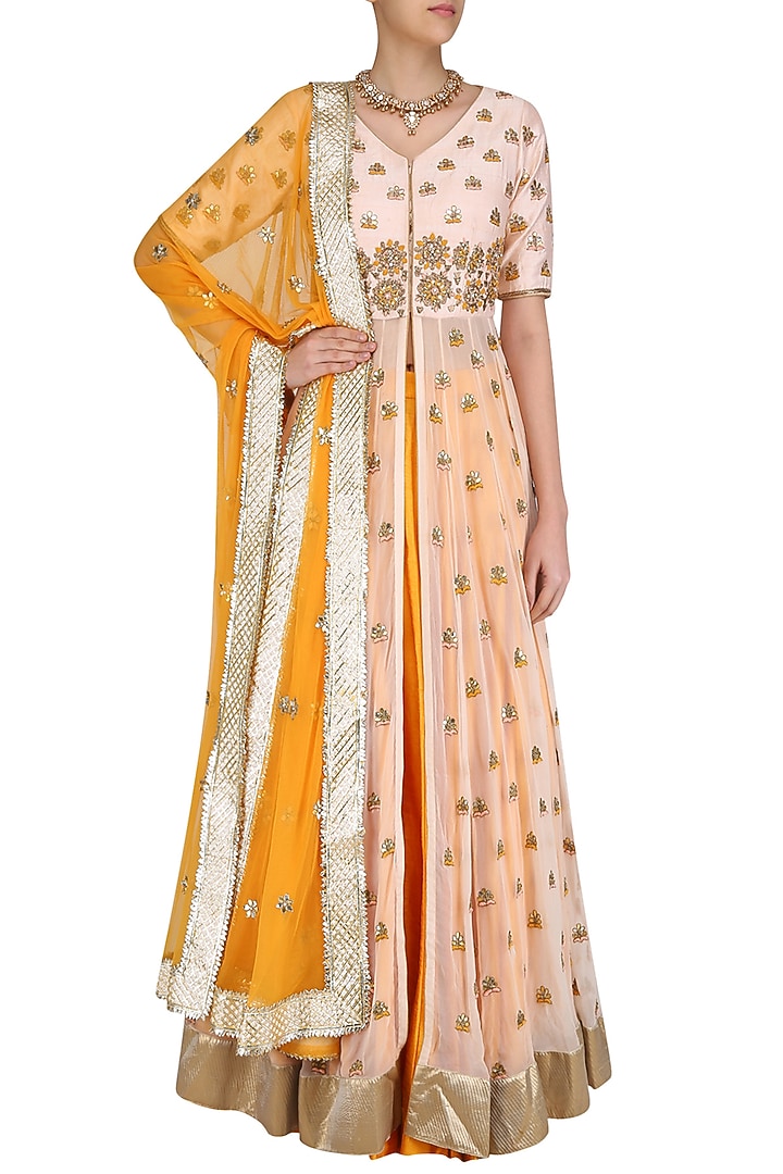 Peach gota patti embroidered jacket and mustard skirt set available only at Pernia's Pop Up Shop.
