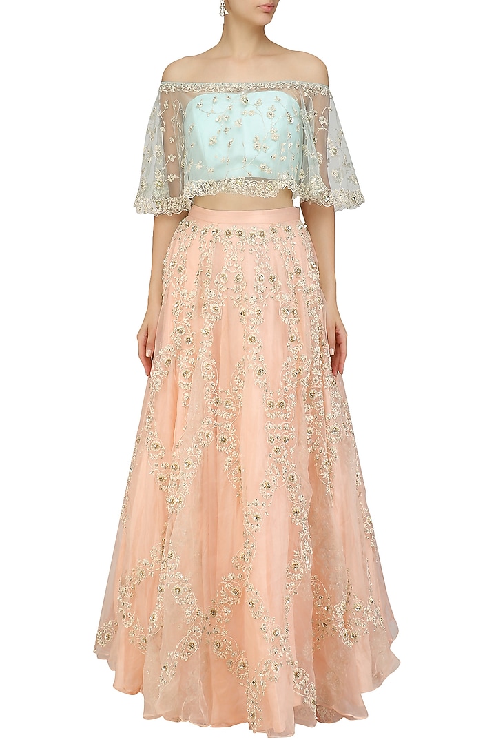 Mint embroidered off shoulder crop top with peach embellished lehenga available only at Pernia's Pop Up Shop.