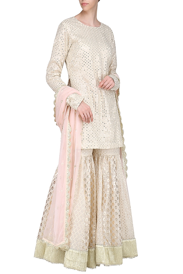 Ivory embroidered sharara set available only at Pernia's Pop Up Shop.