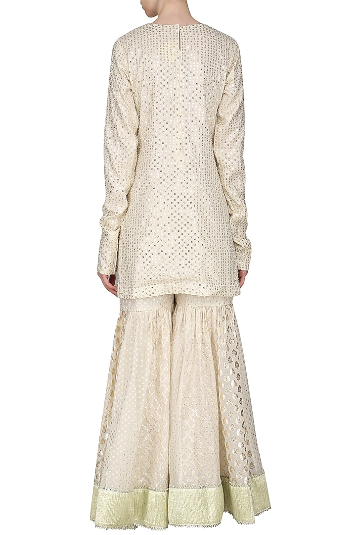 Ivory embroidered sharara set available only at Pernia's Pop Up Shop.