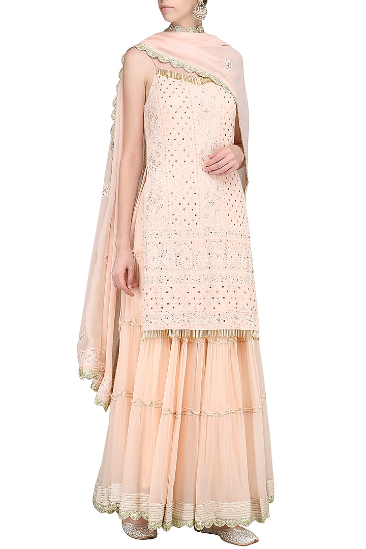 Peach lucknowi embroidered kurta with skirt and dupatta available only at Pernia's Pop Up Shop.