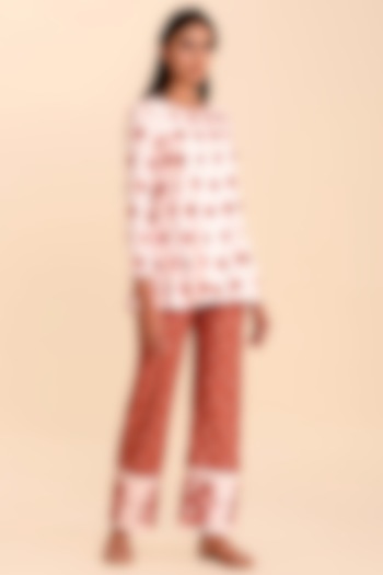 Pink Printed Top With Red Pants by Pasha