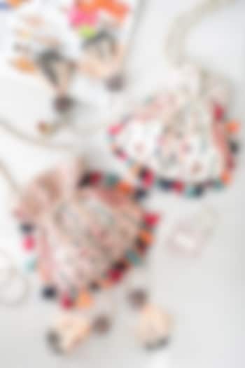 Chalk White Color Dupion Silk Embroidered Potli by PAYAL SINGHAL ACCESSORIES at Pernia's Pop Up Shop