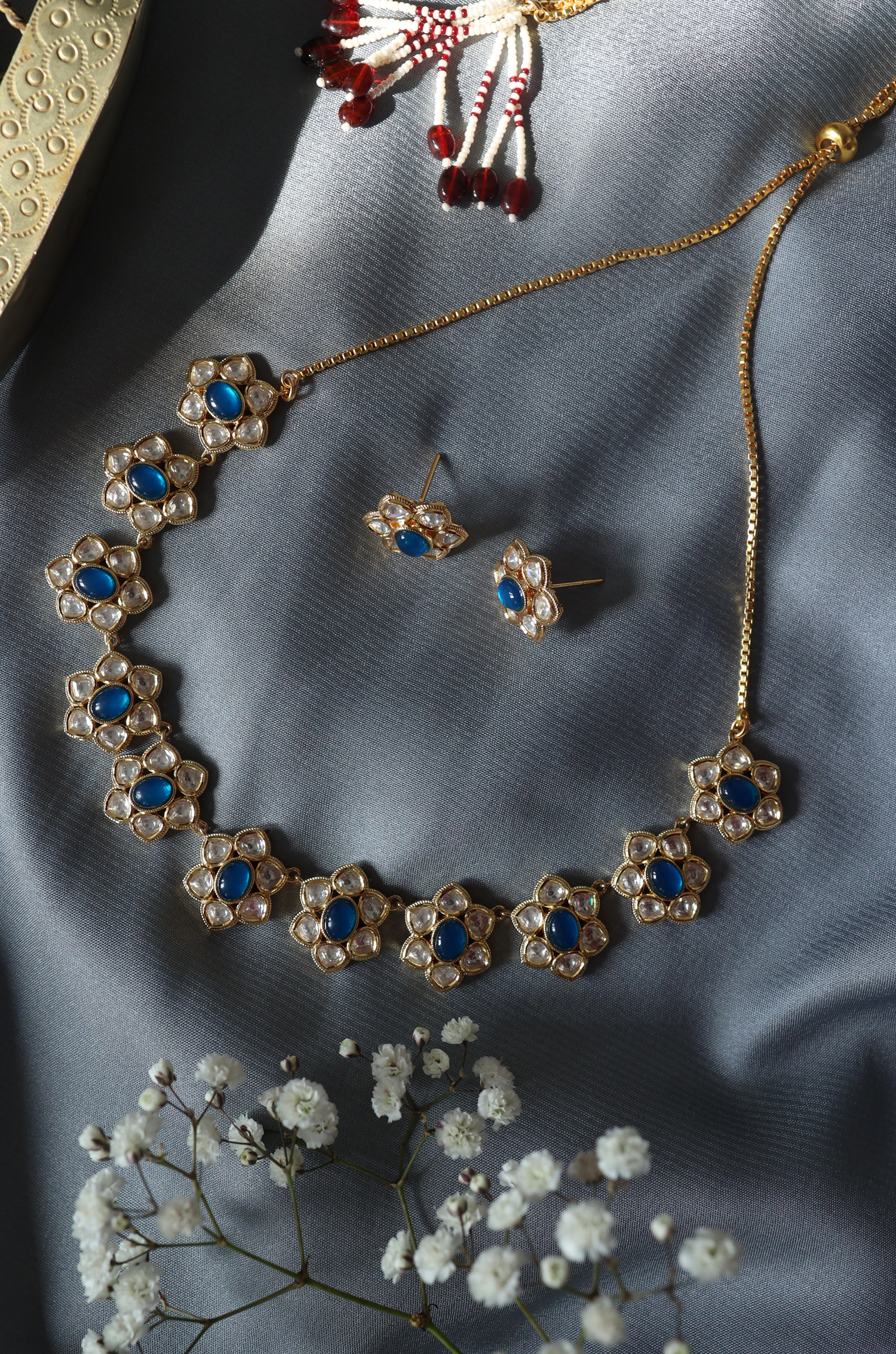 Gold Finish Polki & Sapphire Stone Floral Necklace Set by Paisley Pop