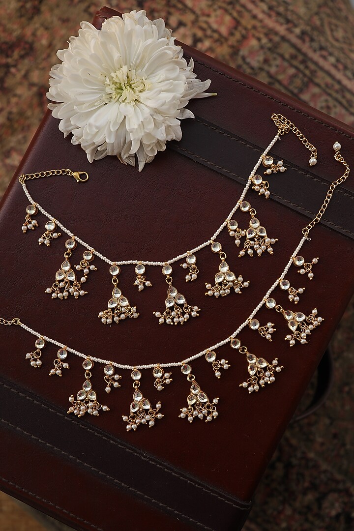 Gold Finish Kundan Polki & Pearl Anklets (Set Of 2) by Paisley Pop at Pernia's Pop Up Shop
