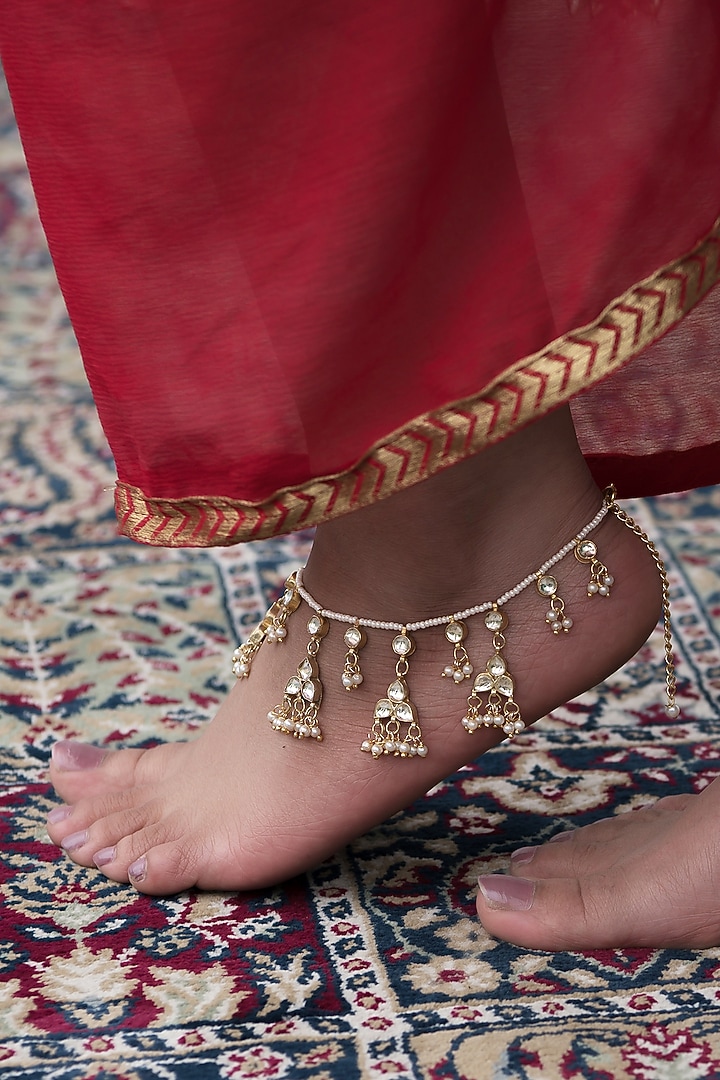 Gold Finish Kundan Polki & Pearl Anklets (Set Of 2) by Paisley Pop at Pernia's Pop Up Shop
