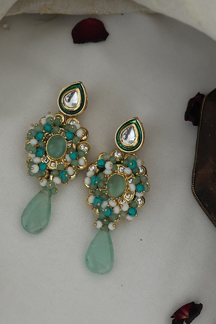 Gold Finish Kundan & Shell Pearl Dangler Earrings by Paisley Pop at Pernia's Pop Up Shop