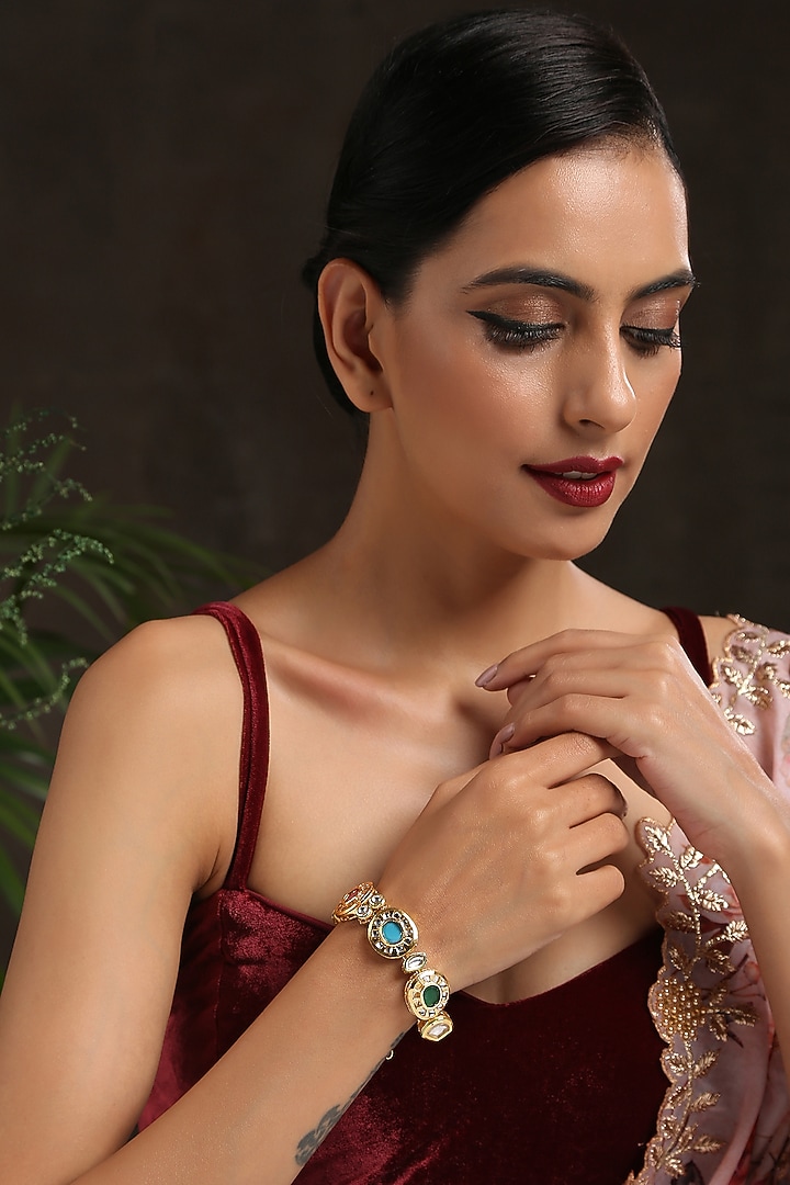 Gold Finish Navratna Stone Bracelet by Paisley Pop at Pernia's Pop Up Shop