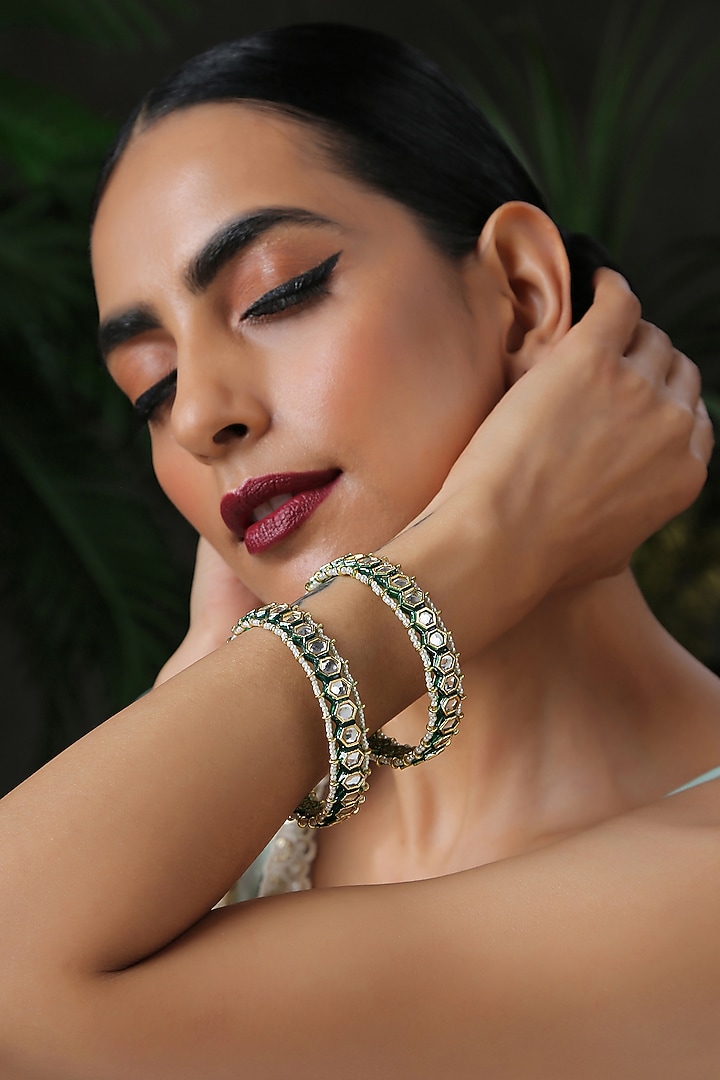 Gold Finish Kundan & Pearls Bangles (Set of 2) by Paisley Pop at Pernia's Pop Up Shop