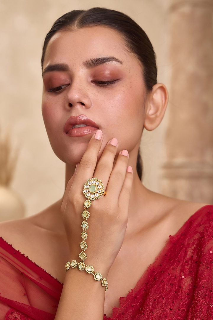 Gold Finish Mint Kundan Polki & Shell Pearl Adjustable Floral Hathphool by Paisley Pop at Pernia's Pop Up Shop