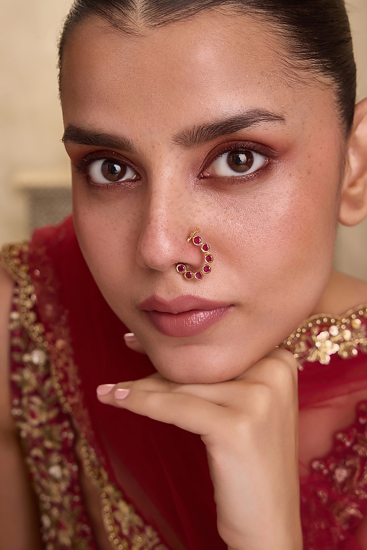 Gold Finish Kundan Polki & Ruby Stone Crescent-Shaped Nose Pin by Paisley Pop at Pernia's Pop Up Shop