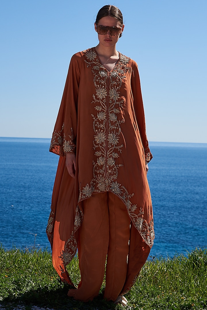 Rust Crepe Embroidered Asymmetrical Cape Set by Pinnacle by Shruti Sancheti