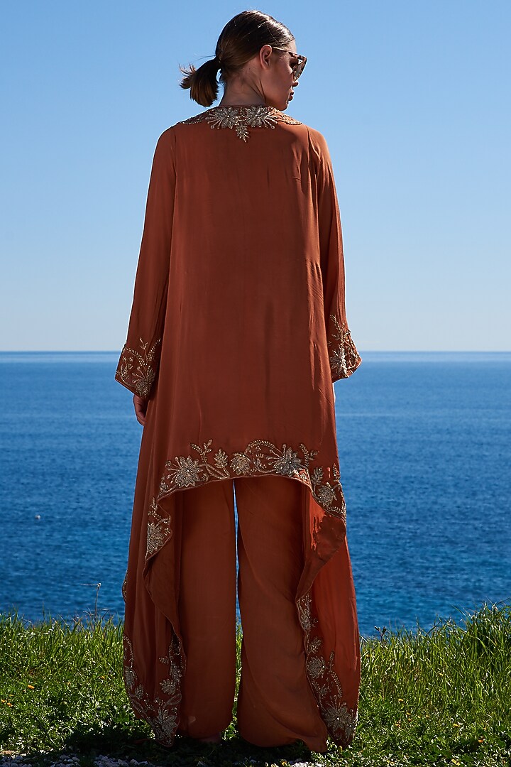 Rust Crepe Embroidered Asymmetrical Cape Set by Pinnacle by Shruti Sancheti at Pernia's Pop Up Shop