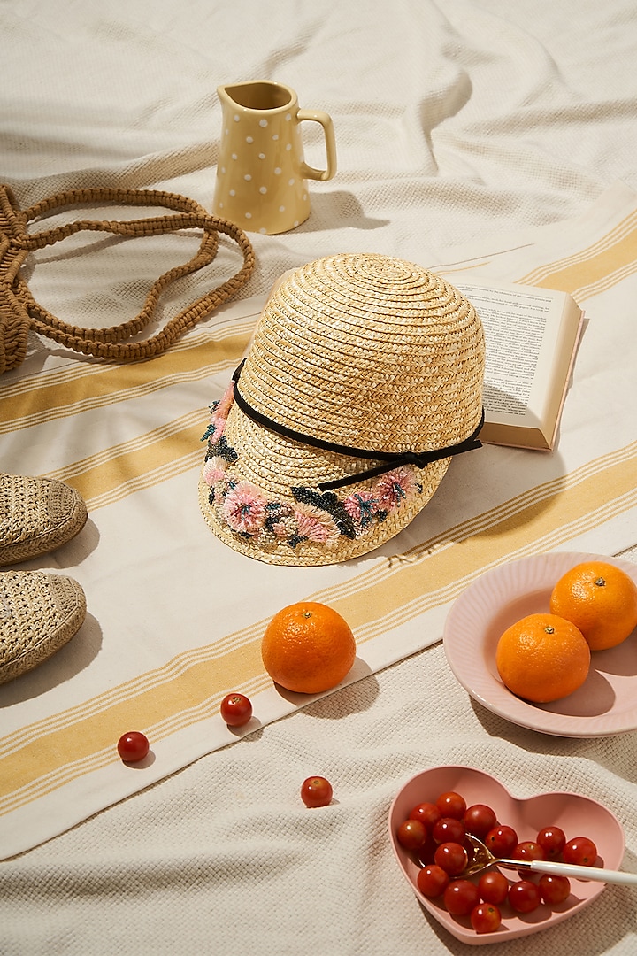 Beige Natural Wheat Straw Floral Embroidered Cap by PAYAL SINGHAL ACCESSORIES at Pernia's Pop Up Shop