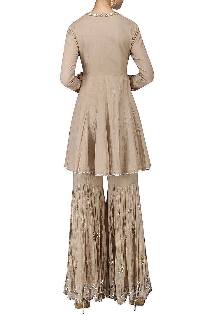 Beige angrakha anarkali and gharara pants set available only at Pernia's Pop Up Shop.