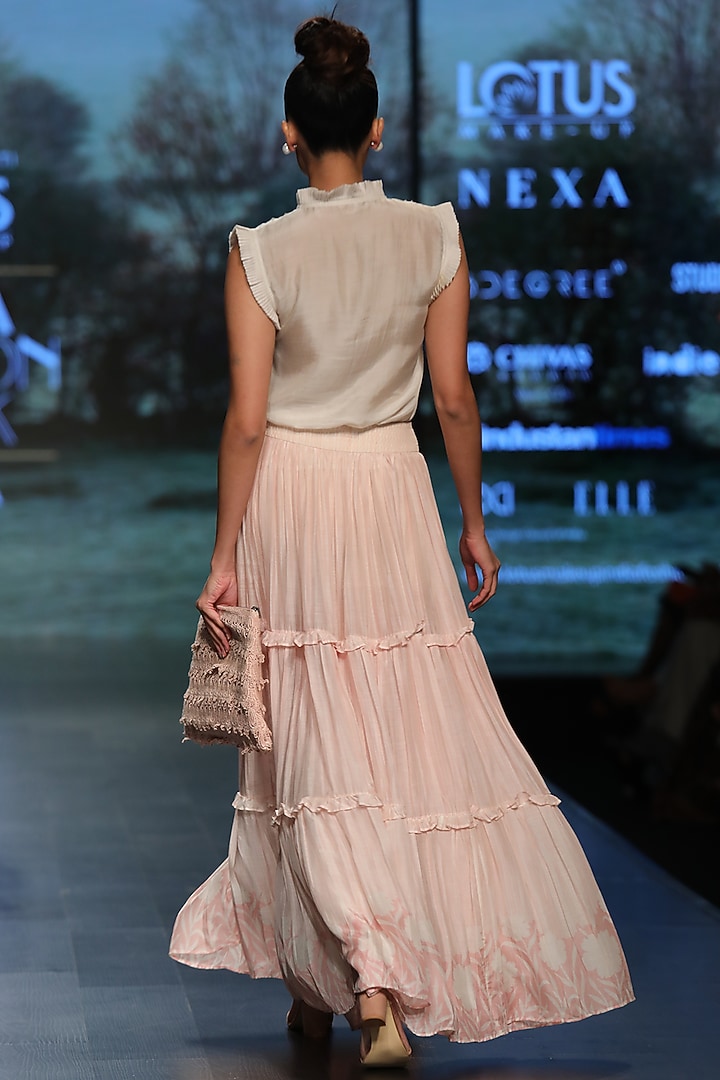 Light beige frill top by Pinnacle By Shruti Sancheti at Pernia's Pop Up Shop