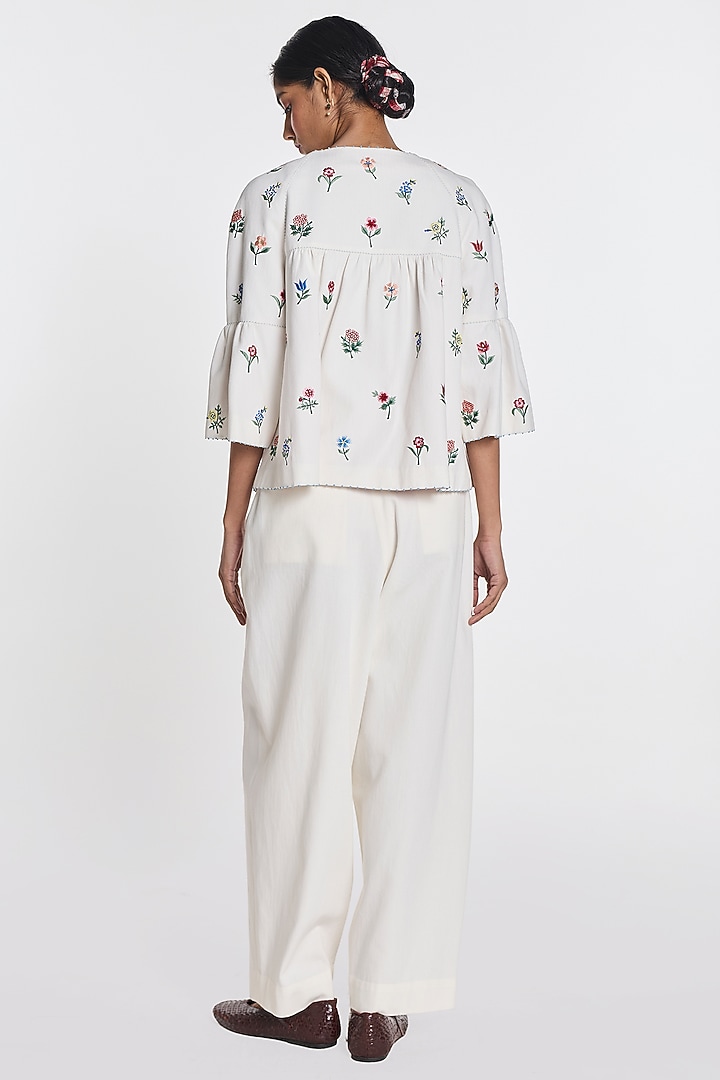 Ivory Denim Floral Embroidered Peplum Jacket by Payal Pratap at Pernia's Pop Up Shop