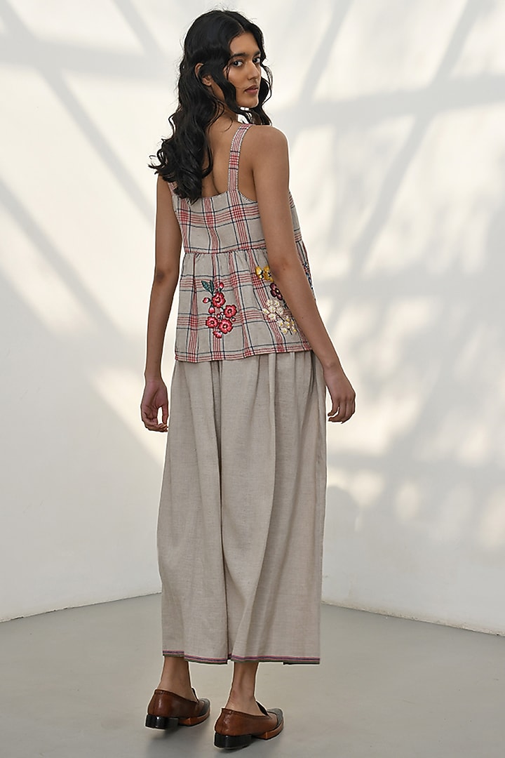 Beige Handloom Linen Floral Thread Embroidered Peplum Top by Payal Pratap at Pernia's Pop Up Shop