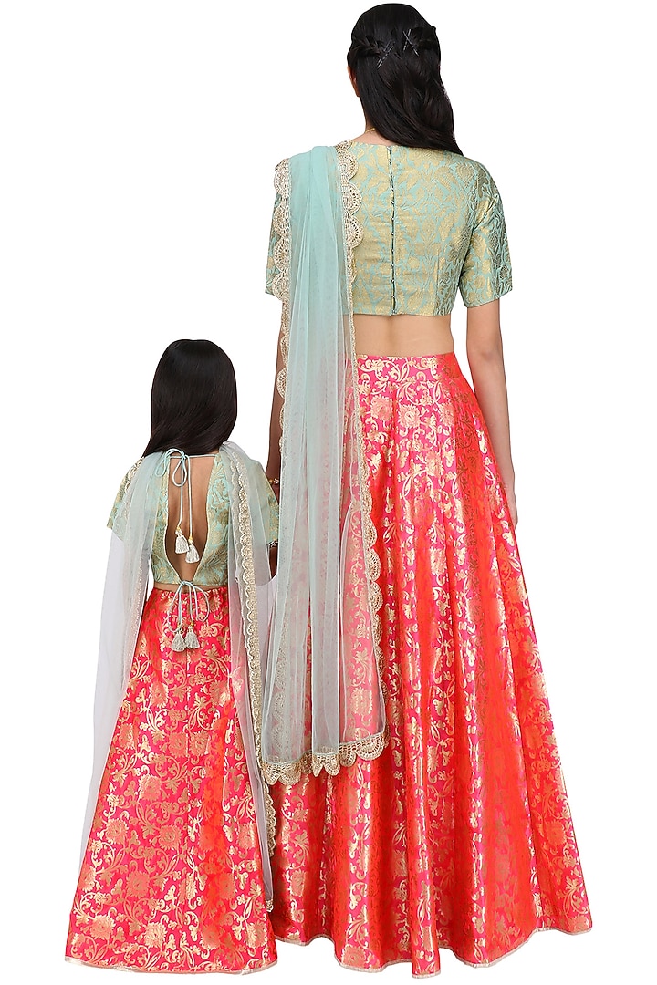 Mother and Daughter mint and hot pink brocade lehenga set available only at Pernia's Pop Up Shop.