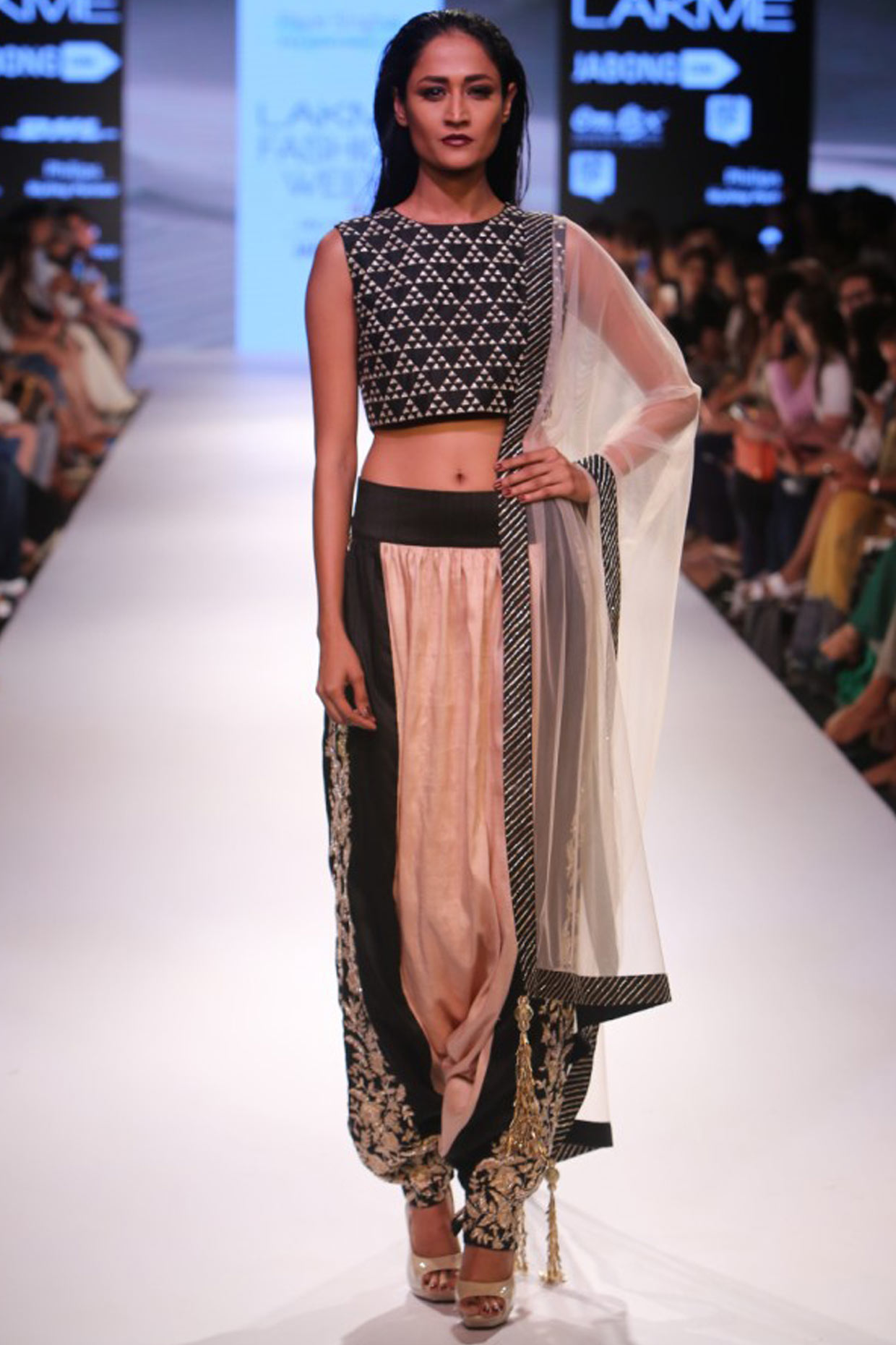 Black embroidered crop top with blush and black low crotch embellished dhoti pants available only at Pernia's Pop Up Shop.