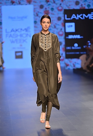 Moss green oversized kurta with green churidaar pants by Payal Singhal