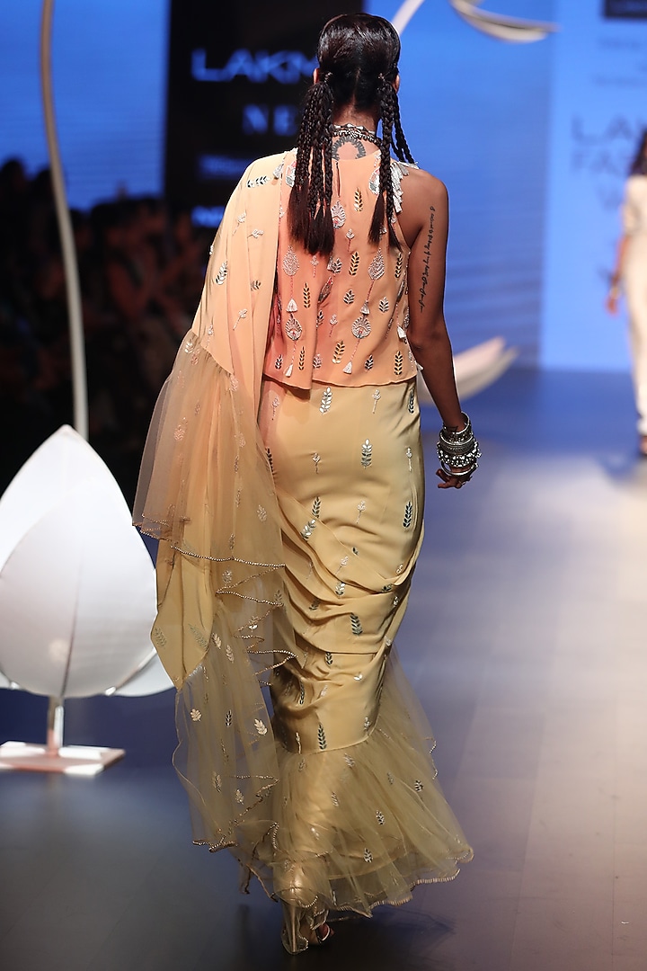 Pale yellow embroidered saree with peach top available only at Pernia's Pop Up Shop.