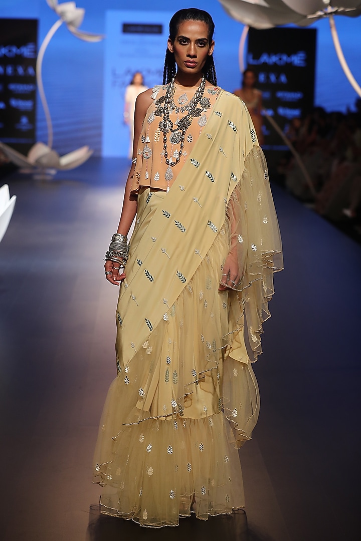Pale yellow embroidered saree with peach top available only at Pernia's Pop Up Shop.