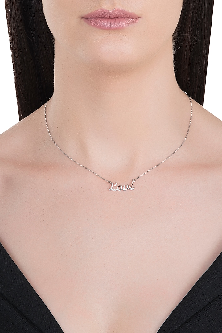 18kt White gold love diamond pendant by Qira Fine Jewellery at Pernia's Pop Up Shop