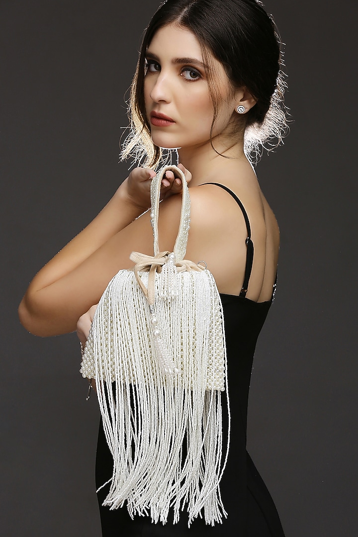 Beige Suede Embroidered Potli by Quirky Tales at Pernia's Pop Up Shop
