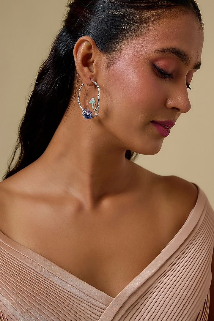 White Finish Cubic Zirconia & Periwinkle Stone Floral Hoop Earrings In Sterling Silver by Raeesa Jewels by Sanjana and Ritu at Pernia's Pop Up Shop
