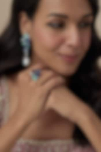 White Finish Cubic Zirconia & Blue Stone Floral Dangler Earrings In Sterling Silver by Raeesa Jewels by Sanjana and Ritu at Pernia's Pop Up Shop