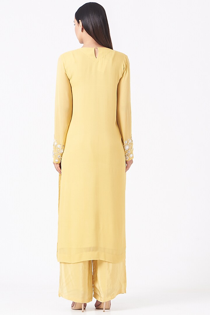 Yellow Hand Embroidered Straight Kurta Set by Radha Sharma at Pernia's Pop Up Shop