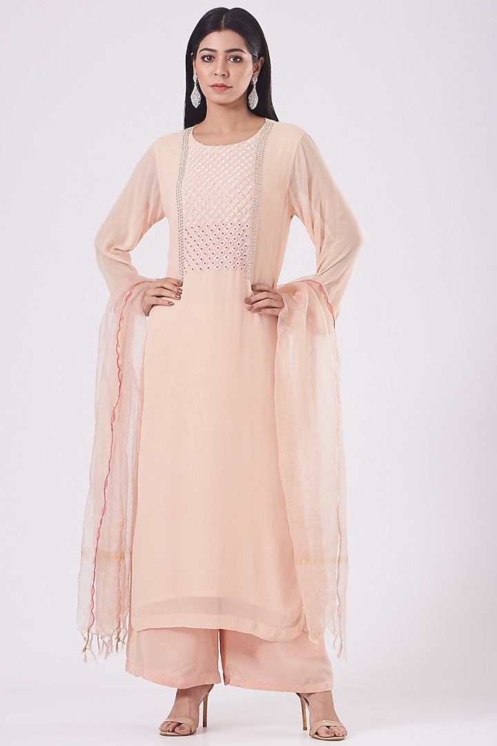 Light Peach Hand Embroidered Kurta Set by Radha Sharma