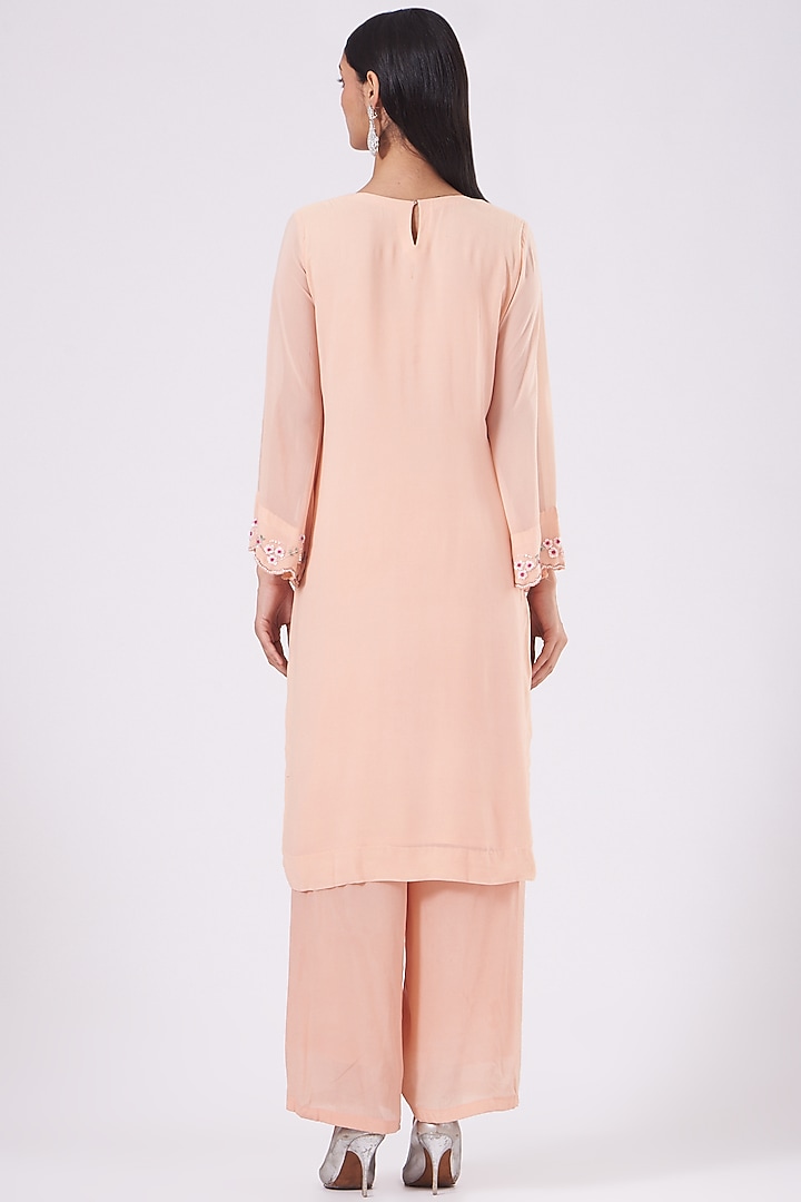 Salmon Peach Hand Embroidered Kurta Set by Radha Sharma at Pernia's Pop Up Shop